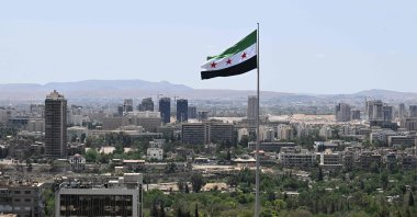 A large Syrian flag flutters above Tishreen Park, Damascus, Syria, June 4, 2025. (AFP Photo)