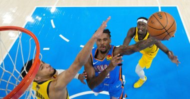Oklahoma City Thunder guard Cason Wallace (C) shoots against Indiana Pacers guard Tyrese Haliburton (L) during the first half of game two of the 2025 NBA Finals at Paycom Center, Oklahoma City, Oklahoma, U.S., June 8, 2025. (Reuters Photo)