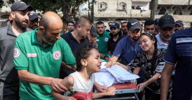 Mourners bid farewell to the body of one of three paramedics killed the previous day by Israeli bombardment on the Tuffah neighbourhood, during the funeral at the Sheikh Radwan Clinic in the Sheikh Radwan neighbourhood, Gaza City, Palestine, June 10, 2025. (AFP Photo)