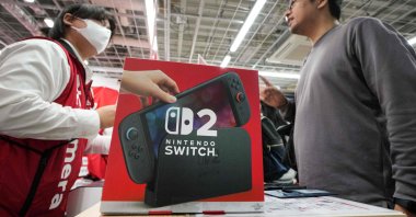 A customer purchases a Nintendo Switch 2 at an electronics retailer in Tokyo, Japan, June 5, 2025. (AFP Photo)