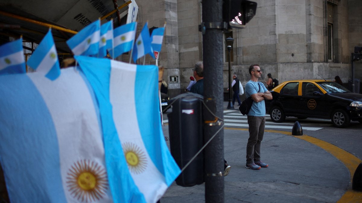 A man stands next to a street store selling Argentine flags in downtown Buenos Aires, Argentina, April 14, 2025. (Reuters Photo)