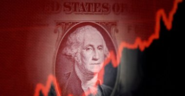 U.S. dollar banknote and rising stock graph are seen in this illustration taken April 25, 2025. (Reuters Photo)