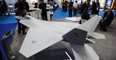 Visitors stand near miniatures of Turkish combat aircraft Kaan during the Indo Defense 2025 exhibition, Jakarta, Indonesia, June 12, 2025. (EPA Photo)