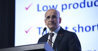 Treasury and  Finance Minister Mehmet Şimşek delivers a speech at a summit, Istanbul, Türkiye, May 30, 2025. (AA Photo)