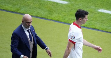 Poland's Robert Lewandowski (R) walks past Poland's head coach Michal Probierz during a Group D match between Poland and Austria at the Euro 2024 tournament, Berlin, Germany, June 21, 2024. (AP Photo)