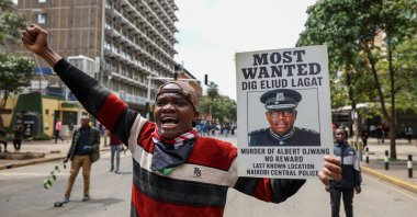 A protester displays a placard during a protest in the central business district, Nairobi, Kenya, June 2025. (EPA Photo)