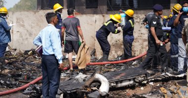 Firefighters work at the site of a plane crash near Sardar Vallabhbhai Patel International Airport in Ahmedabad, Gujarat, western India, June 12, 2025. (EPA Photo)