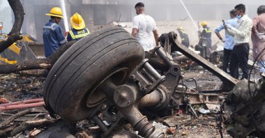 People are seen at the site of an airplane that crashed in the northwestern city of Ahmedabad in Gujarat state, India, June 12, 2025. (EPA Photo)