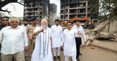 Indian Prime Minister Narendra Modi (C) visits the site of an airplane crash near Sardar Vallabhbhai Patel International Airport in Ahmedabad, Gujarat, India, June 13, 2025. (EPA Photo)