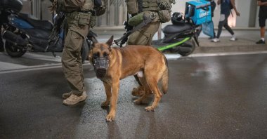 Police officers patrol the streets following an Iranian missile attack, June 13, 2025. (Reuters Photo)