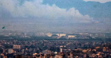 Smoke and fire billow from the site of an alleged Israeli strike in southern Tehran, June 13, 2025. (AFP Photo)