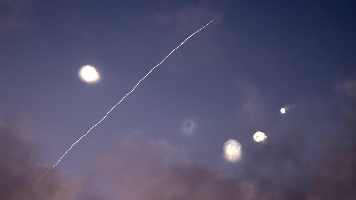 This photo shows rocket trails and intercepts in the sky over the Israeli city of Netanya, June 14, 2025. (AFP Photo)
