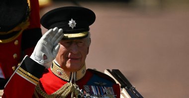 Britain&#039;s King Charles III salutes as he makes his way from Buckingham Palace to Horse Guards Parade for the King&#039;s Birthday Parade, &quot;Trooping the Colour&quot;, in London, Britain, June 14, 2025. (AFP Photo)