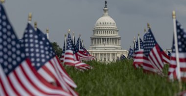 American flags adorn the streets as the White House is seen in the backdrop ahead of a military parade for teh 250th annviersary of the U.S. military, Washington DC, U.S., June 14, 2025. (AA Photo)