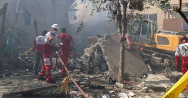 Iranian Red Crescent volunteers working in a Tehran neighbourhood hit by a reported Israeli strike, Tehran, Iran, June 14, 2025. (AFP Photo)