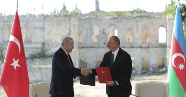Azerbaijani President Ilham Aliyev (R) and President Recep Tayyip Erdoğan shake hands after they signed the Shusha Declaration, Shusha, Azerbaijan, June 15, 2021. (AP Photo)