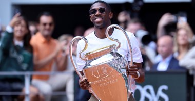 PSG forward Ousmane Dembele arrives with the UEFA Champions League trophy on Court Philippe-Chatrier at the French Open, at Roland Garros, Paris, France, June 2, 2025. (EPA Photo)