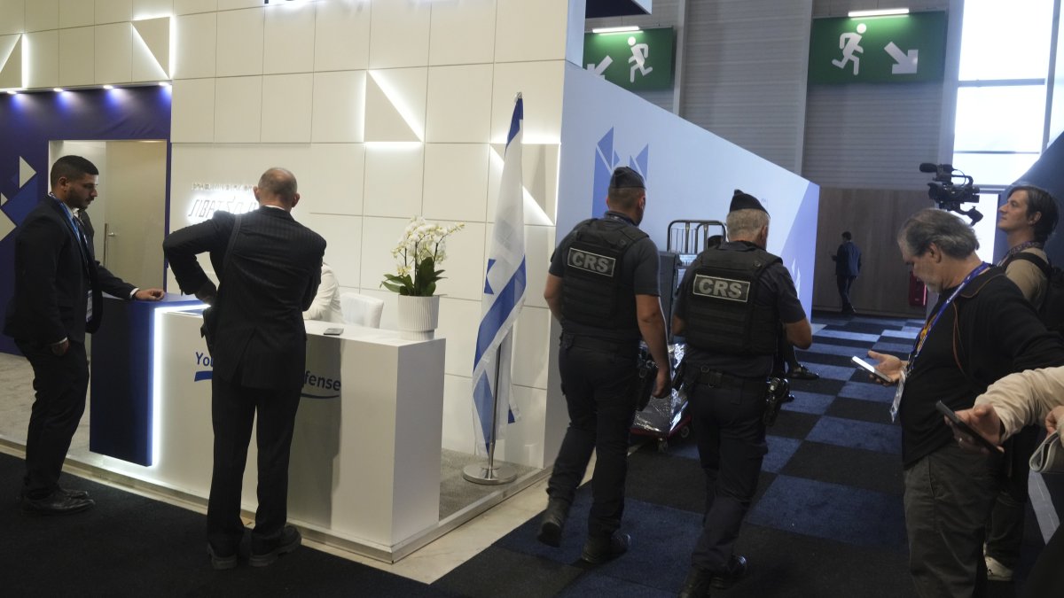 Riot police officers patrol by the Israeli pavilions at the Paris Air Show in Le Bourget, north of Paris, France, June 16, 2025.  (AP Photo)