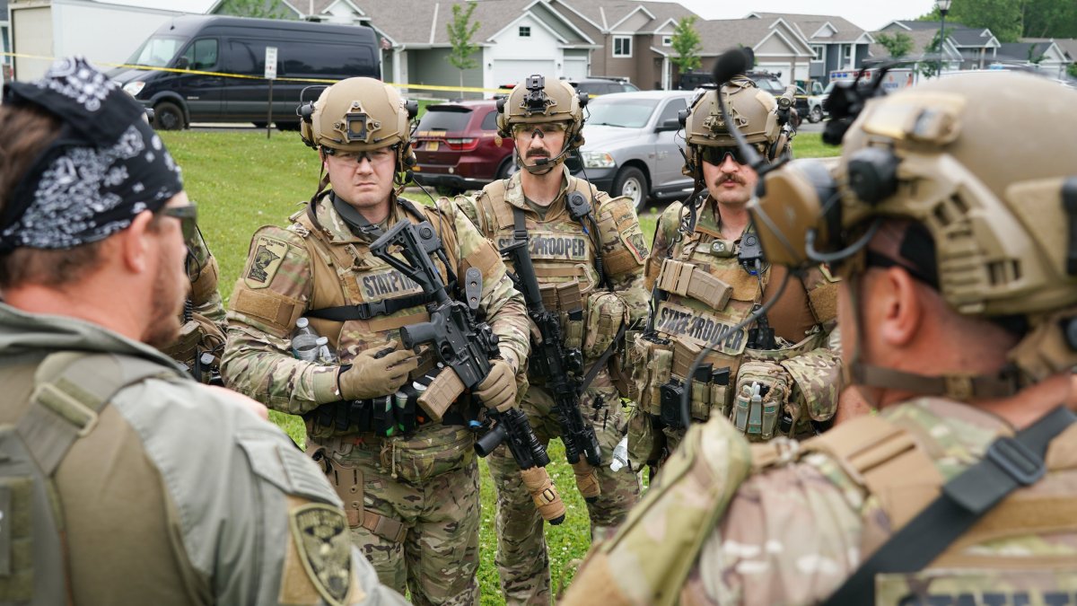 Authorities gather at a baseball park as they search for the 57-year-old Vance Luther Boelter in Green Isle, Minnesota, U.S., June 15, 2025. (EPA Photo)