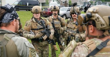 Authorities gather at a baseball park as they search for the 57-year-old Vance Luther Boelter in Green Isle, Minnesota, U.S., June 15, 2025. (EPA Photo)