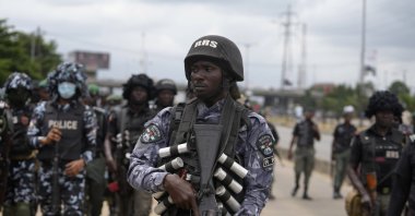 Policemen patrol during a protest against the economic hardship on the street in Lagos, Nigeria, Friday, Aug 2, 2024. (AP File Photo)