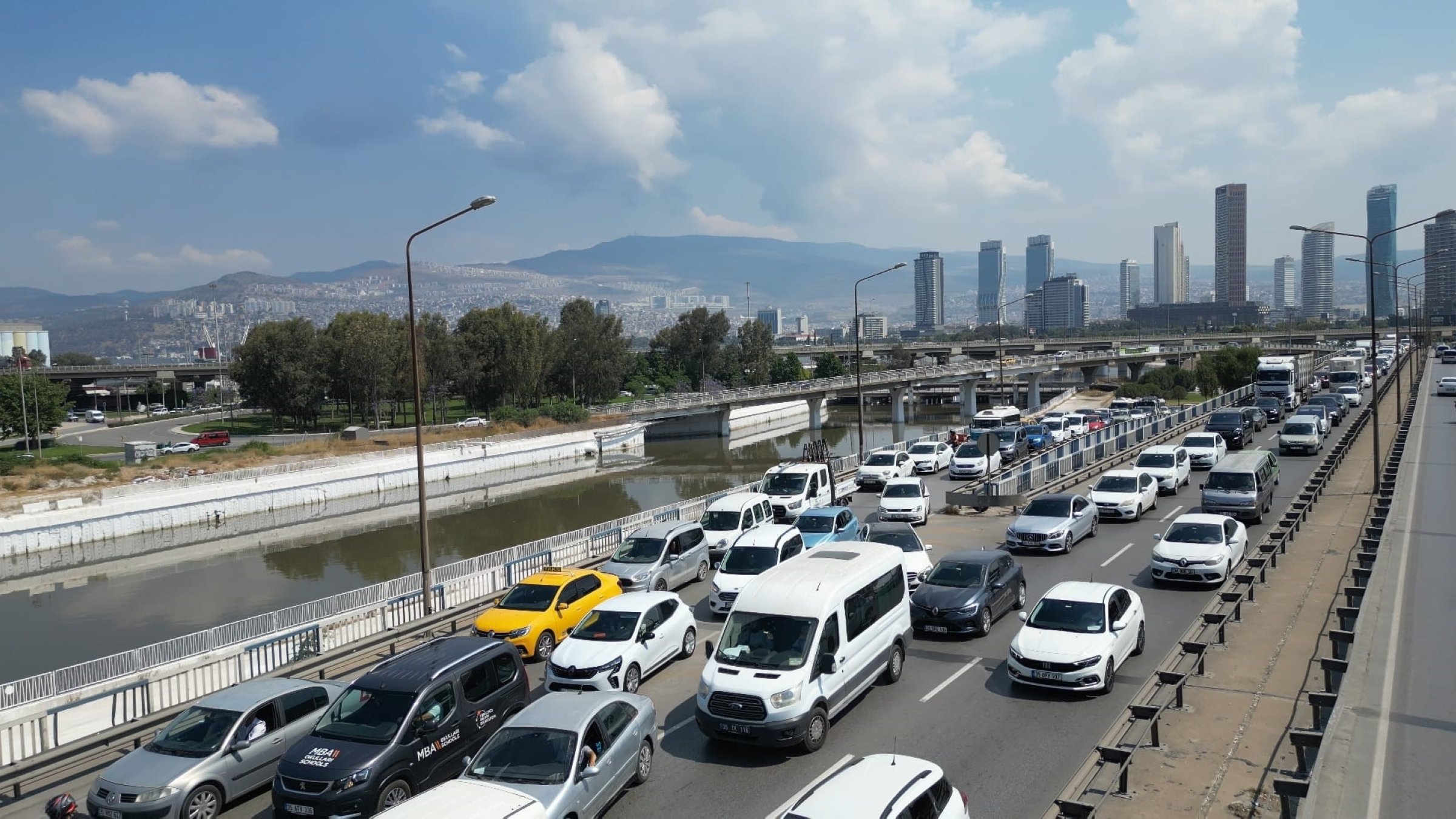 Passenger cars and vehicles are seen on a road in Izmir, western Türkiye, June 17, 2025. (IHA Photo)