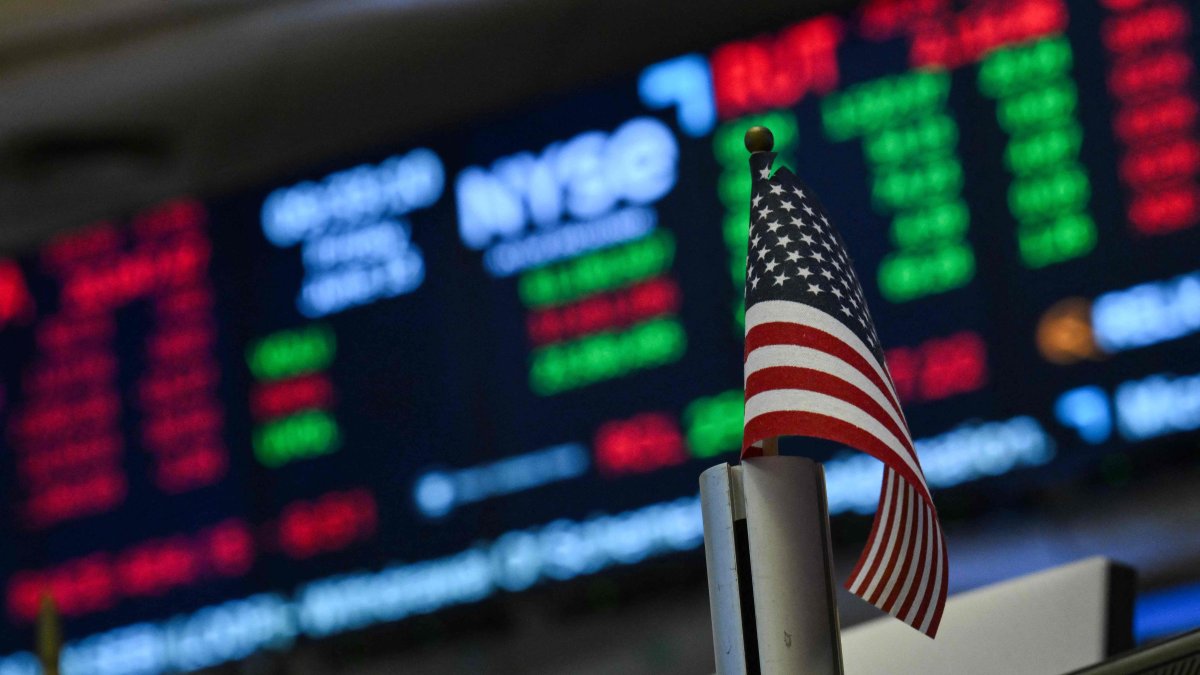 Market statistics are displayed on a screen as traders work on the floor of the New York Stock Exchange (NYSE) at the opening bell, in New York City, U.S., June 13, 2025. (AFP Photo)