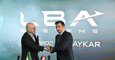 Leonardo CEO Roberto Cingolani (L) shakes hands with Baykar Chairperson and CTO Selçuk Bayraktar as they ink an agreement on a joint venture named LBA Systems during the International Paris Airshow, Paris, France, June 16, 2025. (AA Photo)