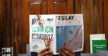 A man holds a Yeşilay magazine focused on antismoking awareness during a public health campaign, Gaziantep, Türkiye, May 22, 2025. (AA Photo)