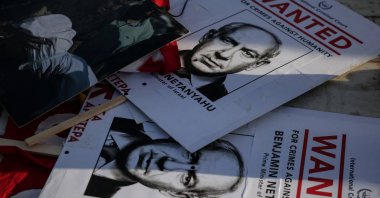 &quot;Wanted&quot; posters with an image depicting Israeli Prime Minister Benjamin Netanyahu lie on the street, during a rally in support of the Palestinian people, Athens, Greece, May 21, 2025. (Reuters File Photo)