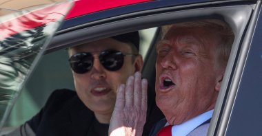 U.S. President Donald Trump and Tesla CEO Elon Musk sit in a Tesla car, in front of the White House, Washington, U.S., March 11, 2025. (Reuters photo)