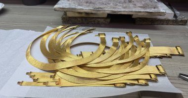 Gold belts handcrafted with intricate traditional designs are displayed in Trabzon’s jewelry workshops, Türkiye, June 17, 2025. (AA Photo)