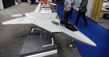 Visitors stand near miniatures of the Turkish combat aircraft Kaan during the Indo Defense 2025 exhibition, Jakarta, Indonesia, June 12, 2025. (EPA Photo)