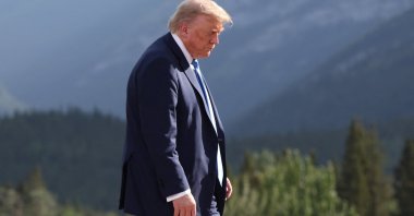 US President Donald Trump departs after a family photo during the G-7 Summit in Kananaskis, Alberta, Canada, June 16, 2025. (EPA Photo)