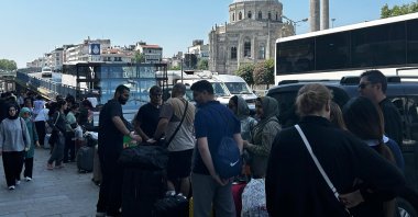 Iranian nationals waiting to board a bus to Iran, Istanbul, Türkiye, June 16, 2025. (İHA Photo)