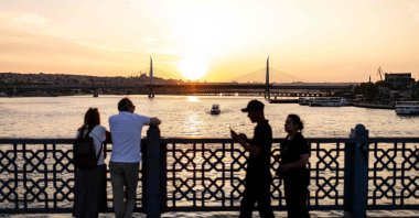 People walk along the Galata Bridge, Istanbul, Türkiye, June 16, 2024. (AFP Photo)