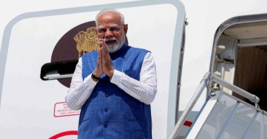 Indian Prime Minister Narendra Modi gestures as he steps off the plane upon his arrival in Zagreb, Croatia, June 18, 2025. (AFP Photo)