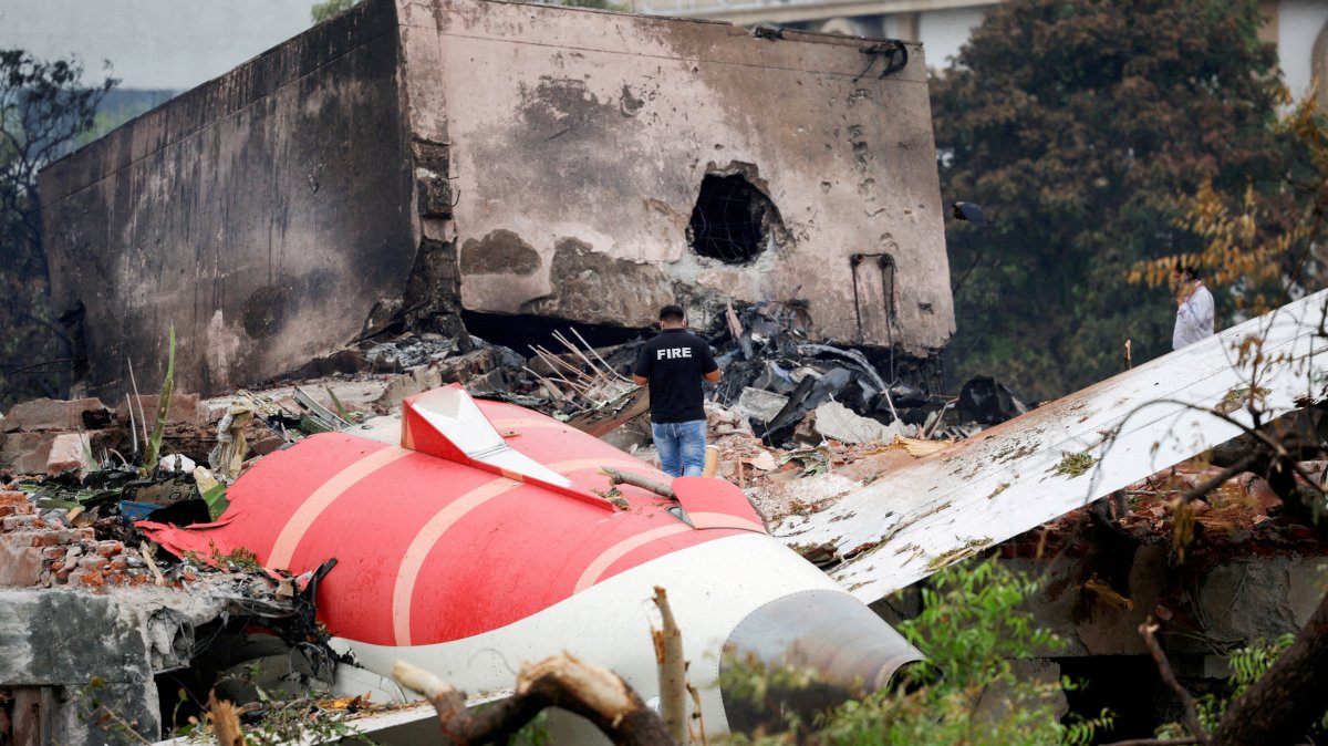 A fire officer stands next to the crashed Air India Boeing 787-8 Dreamliner aircraft, Ahmedabad, India, June 13, 2025. (Reuters Photo)