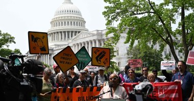 Protesters gather to demonstrate before a press conference to call on Republican senators to vote against the budget and policy package passed by House Republicans, also known as the &quot;One Big Beautiful Bill Act,&quot; on Capitol Hill, Washington, U.S., June 3, 2025. (AFP Photo)