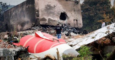 A fire officer stands next to the crashed Air India Boeing 787-8 Dreamliner aircraft, Ahmedabad, India, June 13, 2025. (Reuters Photo)