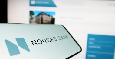 A smartphone with the logo of the Norwegian central bank, Norges Bank, displayed on its screen, Stuttgart, Germany, Feb. 4, 2023. (Shutterstock Photo)