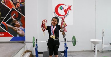 Turkish para-weighlifter Esra Nisa Özkılsız shows off her medal collection, June 17, 2025. (AA Photo)