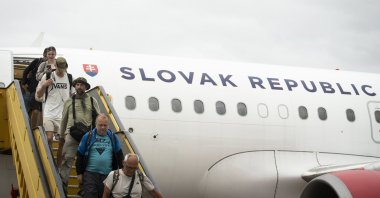 People disembark from a Slovak government flight arriving from Amman, Jordan in Bratislava, Slovakia, June 16, 2025. (EPA Photo)