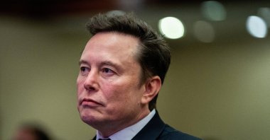 Tesla CEO and X owner Elon Musk listens as U.S. President-elect Donald Trump speaks during a meeting with House Republicans at the Hyatt Regency hotel in Washington, D.C., U.S. Nov. 13, 2024. (Reuters File Photo)