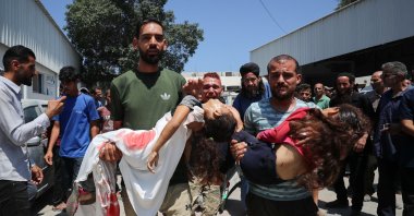 
Relatives carry the bodies of two girls, as they leave Al-Shifa Hospital, after Palestinians were killed by an Israeli strike on a tent encampment sheltering displaced people, in Gaza City, June 19, 2025. (Reuters Photo)