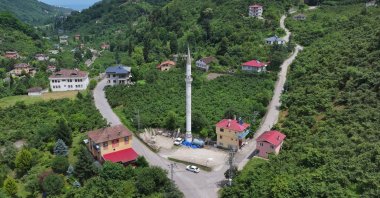 An aerial view shows the lone minaret standing tall, symbolizing the neighborhood’s history amid changing landscapes in Yomra, Trabzon, Türkiye, June 17, 2025. (AA Photo)