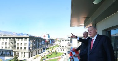 President Recep Tayyip Erdoğan and his Azerbaijani counterpart Ilham Aliyev inspect buildings during the delivery of housing for earthquake victims in Kahramanmaraş province, Türkiye, June 19, 2025 (AA Photo)