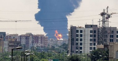 A plume of heavy smoke and fire rise over an oil refinery in southern Tehran, Iran, June 15, 2025. (AFP Photo)