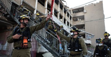 Israeli first responders work at the scene of a reported Iranian strike in Haifa on June 20, 2025, amid the ongoing fire exchange between Israel and Iran. (AFP Photo)
