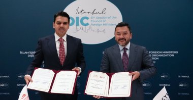 YTB President Abdullah Eren (L) and ICYF President Taha Ayhan hold the signed agreement documents for the Ummah Scholarship Program, Istanbul, Türkiye, June 21, 2025. (AA Photo)